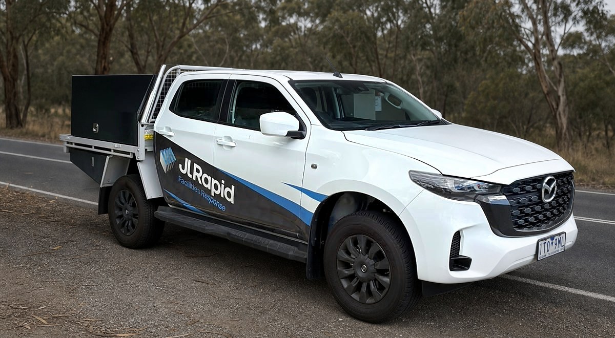 Rapid Facilities Response ute on the road with its original branded livery